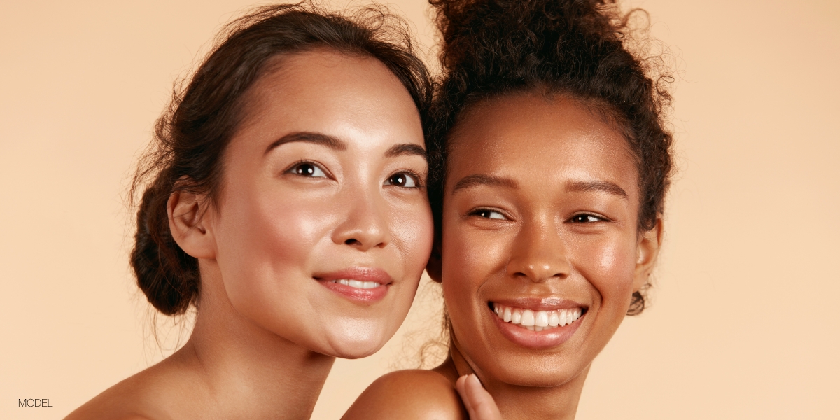 two women together smiling in the distance over discussing a facelift at dfw plastic surgery in forth worth